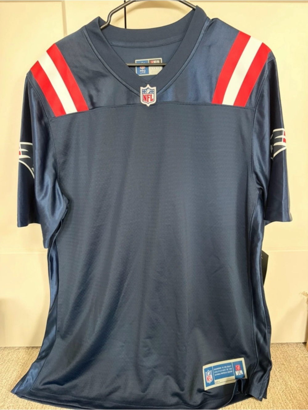 NFL Navy Men's Football Jersey with Red and White Shoulder Stripes